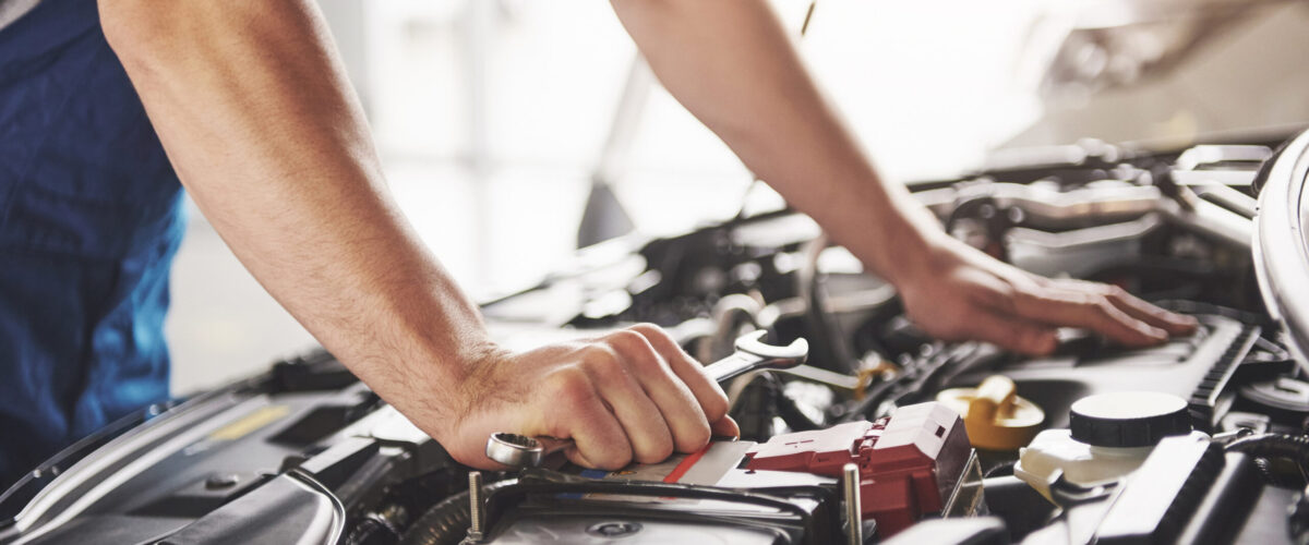 Auto mechanic working garage repair service scaled 1 1200x500