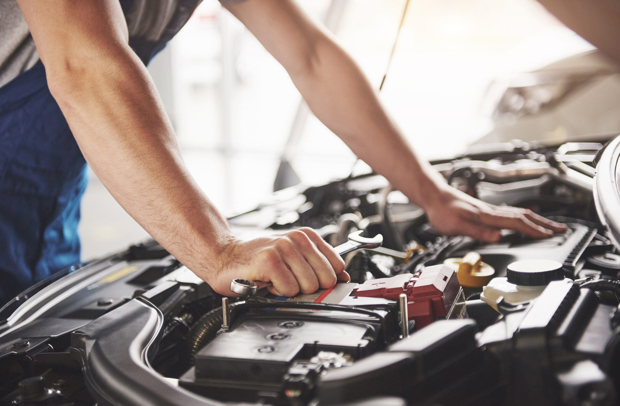 Auto mechanic working garage repair service scaled 1